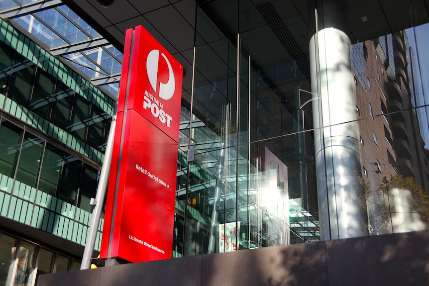 A red sign showing the white Australia Post logo indicates that there is a post office 50 meters away on Bourke Street.