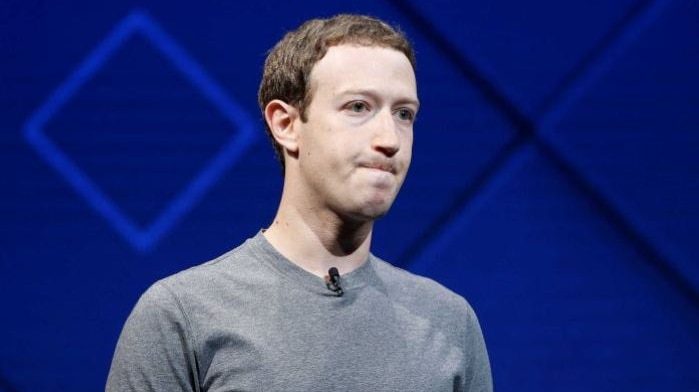 Mark Zuckerberg wears a t-shirt and looks serious.