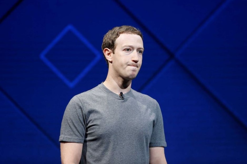 Mark Zuckerberg wears a t-shirt and looks serious.