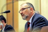 Commonwealth Ombudsman Allan Asher speaks during a Senate committee hearing in Canberra on September 23, 2011.