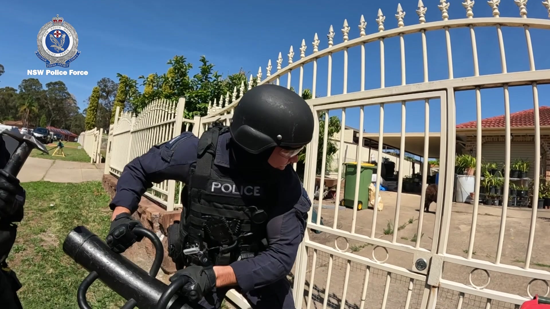 police use battering ram to hit gate