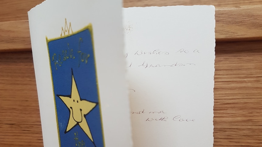 A card with 'reach for the stars' and a picture of a star on the front