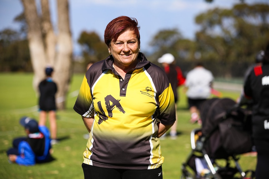 Dot Shipard in a yellow and brown sports top.