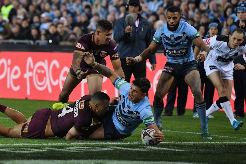 Latrell Mitchell scores a try for the Blues in Origin II