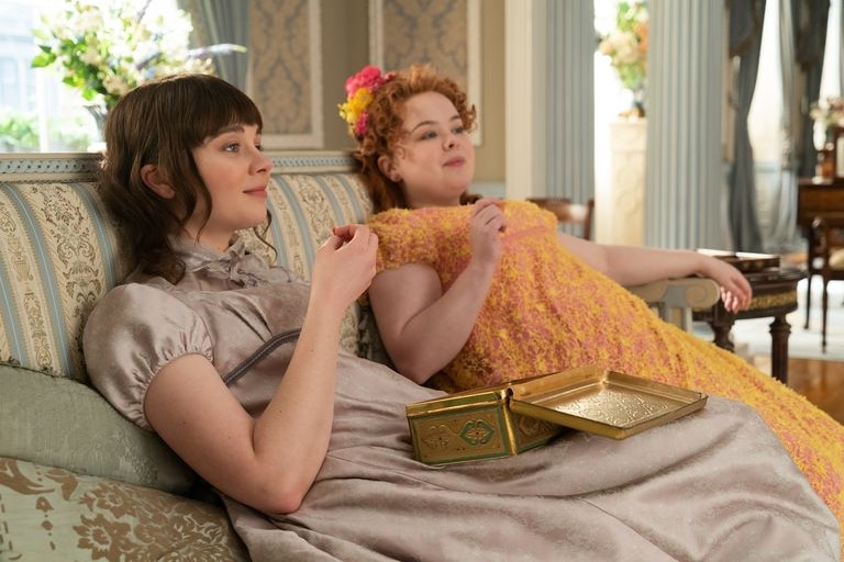 Claudia Jessie (left) as Eloise Bridgerton and Nicola Coughlan (right) as Penelope Featherington in "Bridgerton."