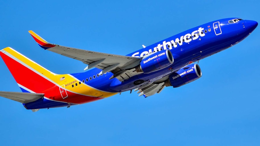 A Southwest Airlines 737-7H4 flying shortly after take off.