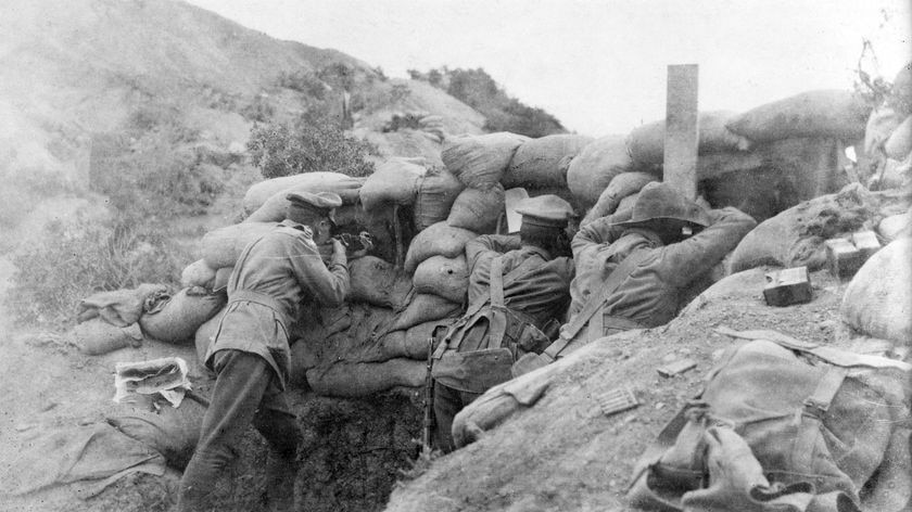 A sniper and two observers at a sandbagged post at Anzac Cove in 1915.