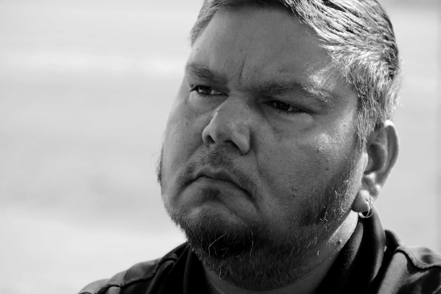 Black and white portrait of Roebourne filmmaker Tyson Mowarin