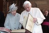 State visit: Pope Benedict exchanges gifts with Queen Elizabeth II at the Palace of Holyroodhouse in Edinburgh