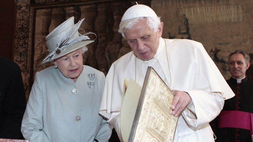 State visit: Pope Benedict exchanges gifts with Queen Elizabeth II at the Palace of Holyroodhouse in Edinburgh