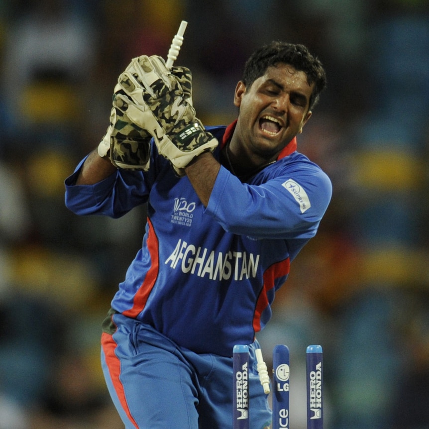 Afghani wicketkeeper Shafiqullah Shafaq whips off the bails