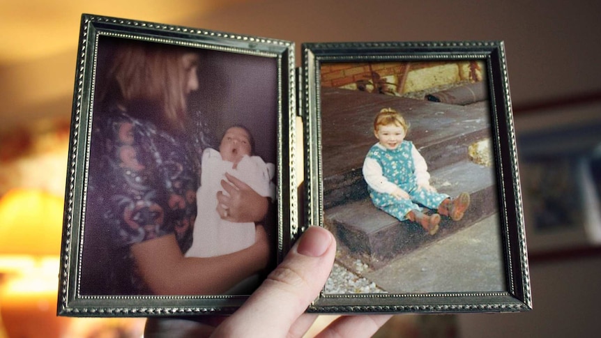 Two photos of a young girl and a little baby being cradled by a woman in a photo frame.