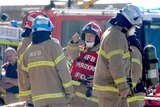 Fire crew at the scene of a plane crash near Essendon airport