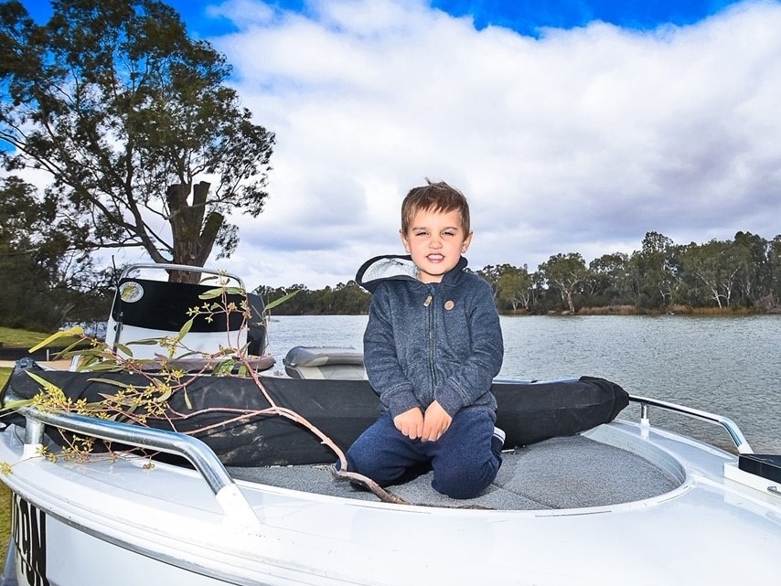 Boy on boat on river.