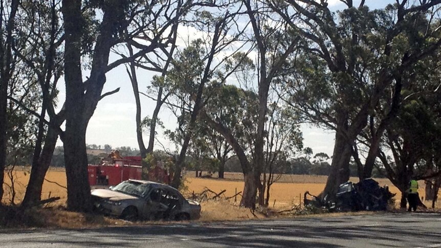 Two wrecked cars beside the road