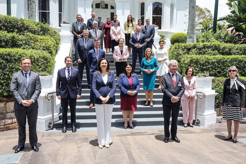Premier Annastacia Palaszczuk and her new Cabinet line-up pose for a group photo on the steps of Government House in Brisbane.