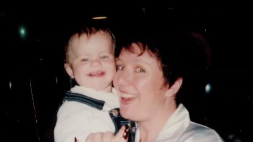 Kathleen Folbigg holds her daughter Laura in her arms