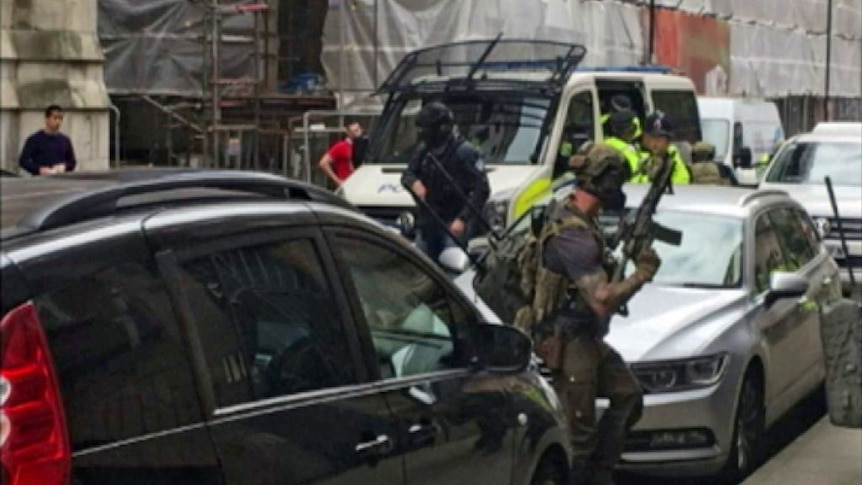 Heavily armed police raid apartment building in central Manchester