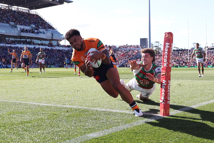 A man goes in to score during a rugby league match