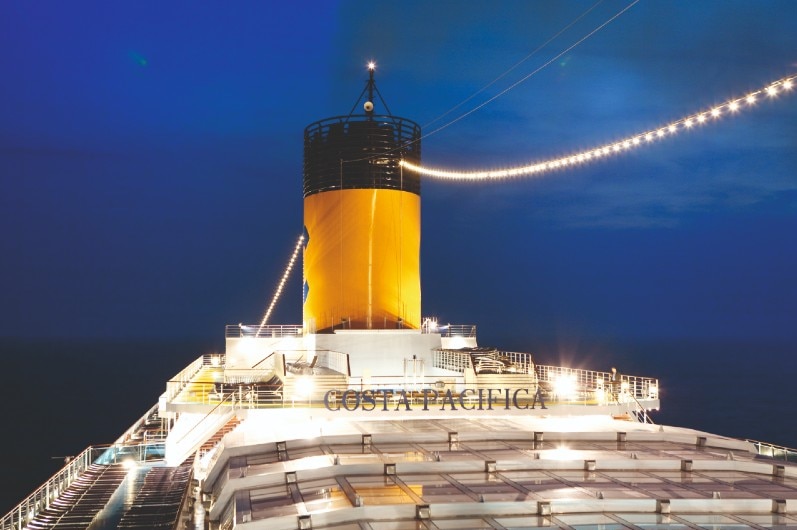 A cruise ship lit up at night.