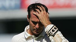 A despondent Michael Vaughan heads back to the pavilion