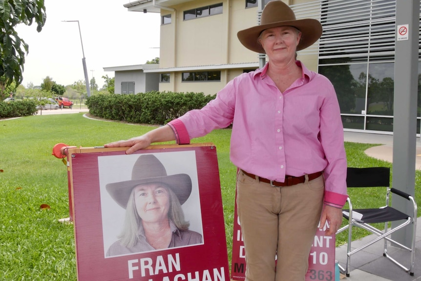 Fran O'Callghan stands next to her placard at pre-poll
