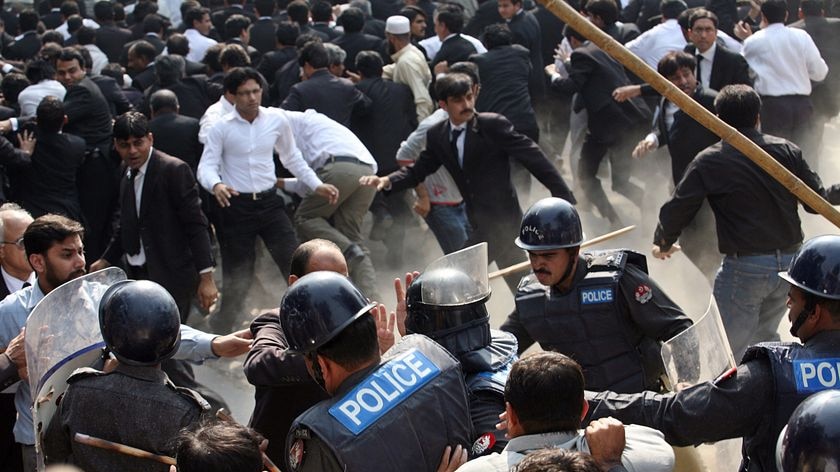 Pakistani riot police baton-charge lawyers during a protest in Lahore.