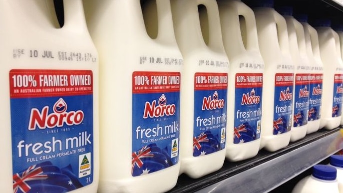 Norco milk bottles in supermarket.