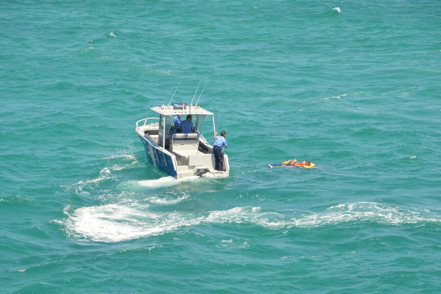 The men were spotted from the SLSWA rescue helicopter which directed water police to them.