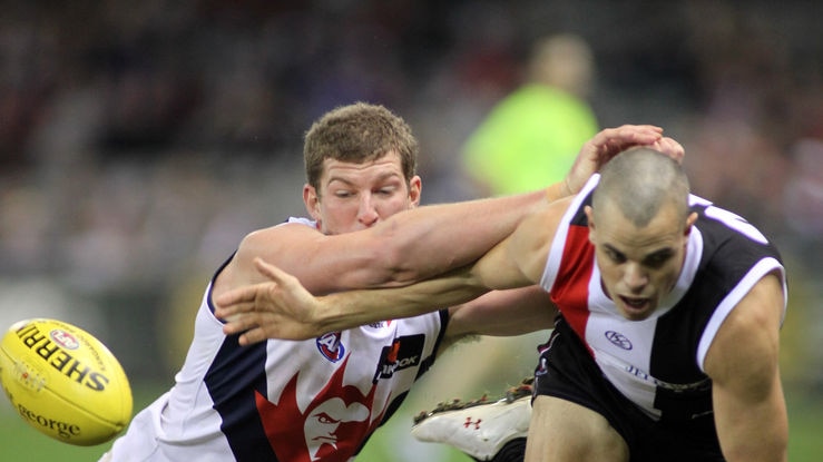 Melbourne's Jake Spencer tussles for the ball with St Kilda's Brett Peake at Docklands.