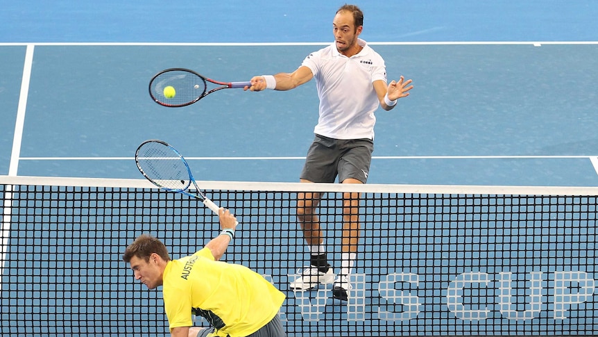 Germany's Tim Puetz (R) hits a winner past Australia's Matt Ebden, in their Davis Cup doubles match.