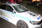 a damaged police car after an alleged stabbing incident at wakeley