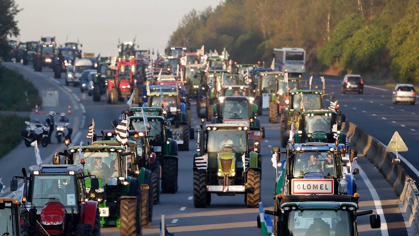 French farmers drive their tractors into Paris