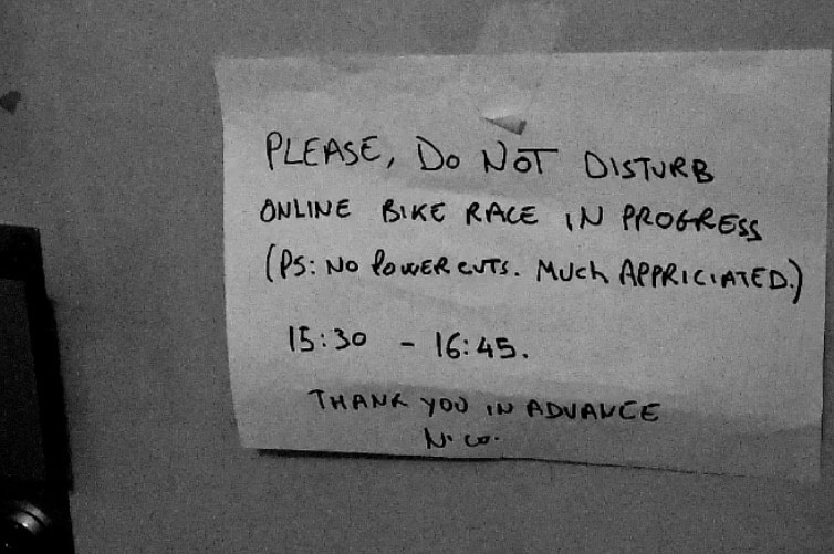 Nicolas Roche leave a note saying Do not disturb, online bike race in progress PS no powercuts, much appreciated