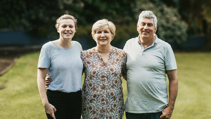 Portrait of Bobby Hendry and her parents, Chris and Peter Harrison for a story about Bobby's teachers becoming her parents.