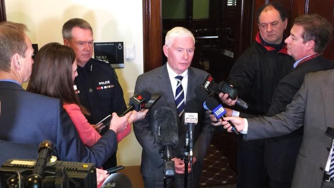 Attorney-General John Rau talks to the media