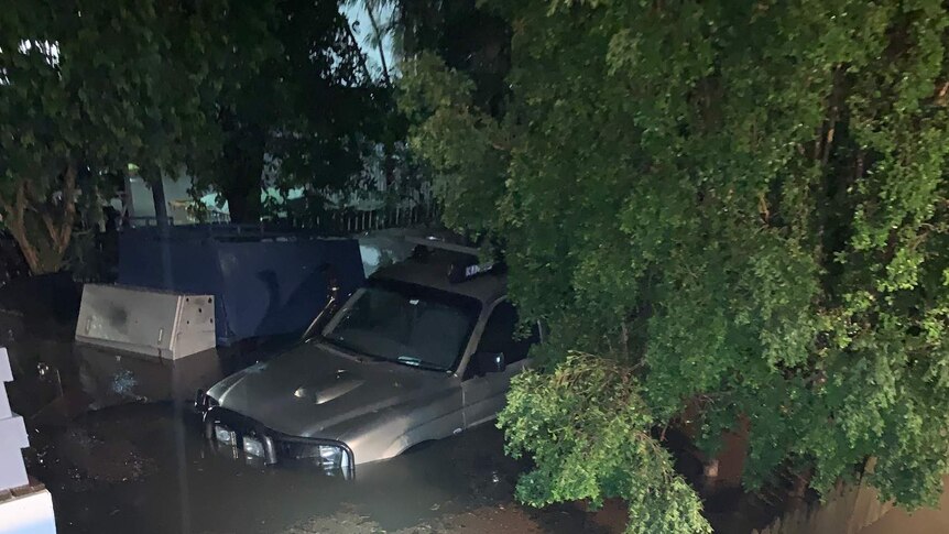 A car submerged at Woolloongabba in Brisbane during last night's storm.