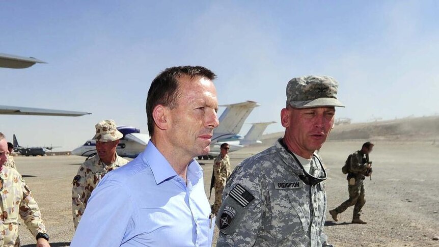 Tony Abbott is greeted by Colonel Jim Creighton