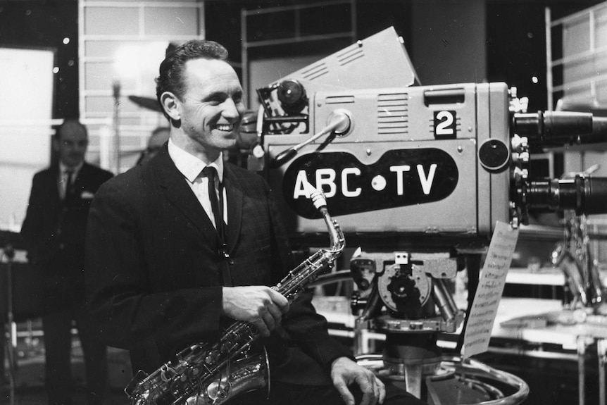 ABC TV archives photo of Don Burrows holding saxophone in studios