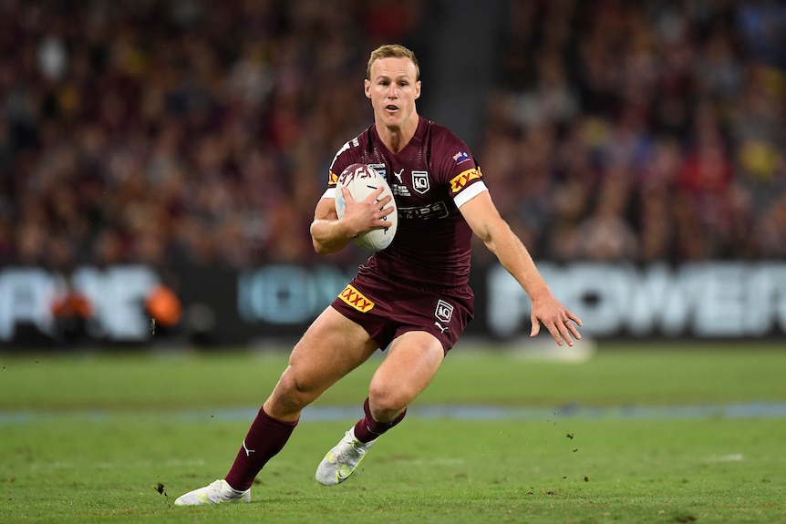 The Queensland skipper, Daly Cherry-Evans, props to change direction while carrying the ball in State of Origin.