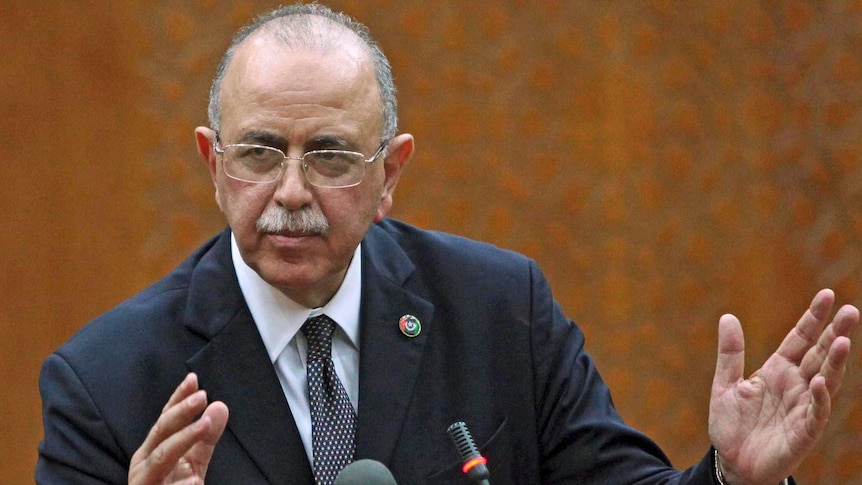 Libya's newly elected interim prime minister Abdul Raheem al-Keeb speaks during a news conference in Tripoli