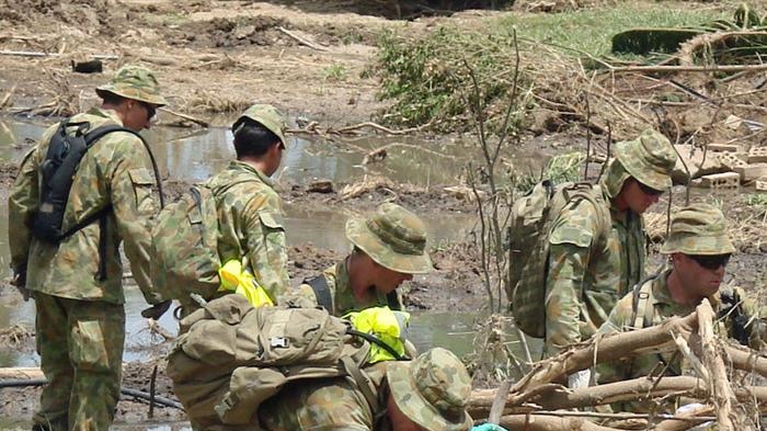 Soldiers and police have been scouring piles of debris in search of nine people still missing after the floods.