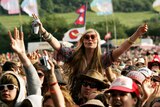 Music fans show their appreciation at the Glastonbury Festival.