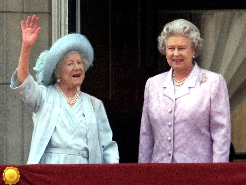 Queen Elizabeth II stands next to The Queen Mother on her 100th birthday.