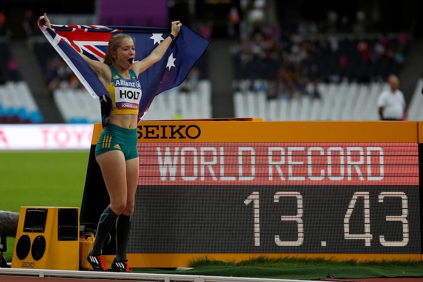 Isis Holt jumps in the air after breaking the world record in the 100m T35 final at the 2017 World ParaAthletics Championships.