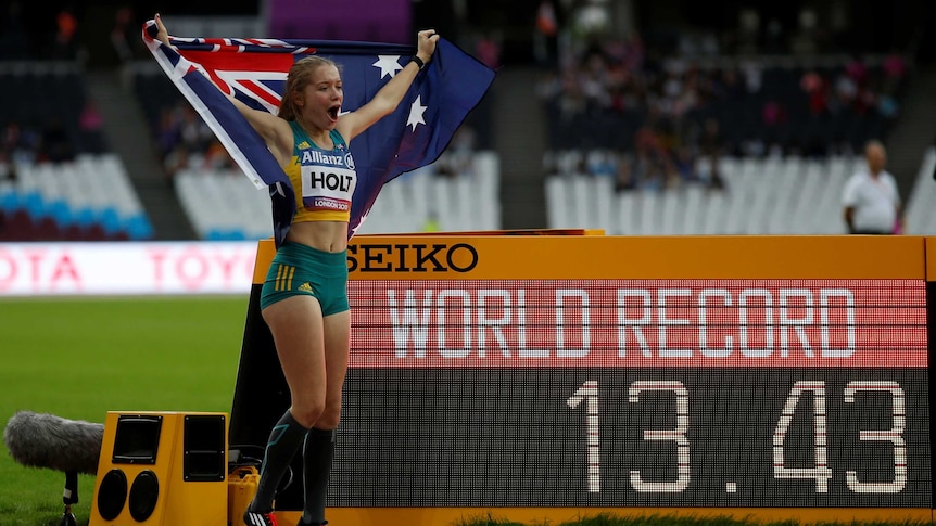 Isis Holt jumps in the air after breaking the world record in the 100m T35 final at the 2017 World ParaAthletics Championships.