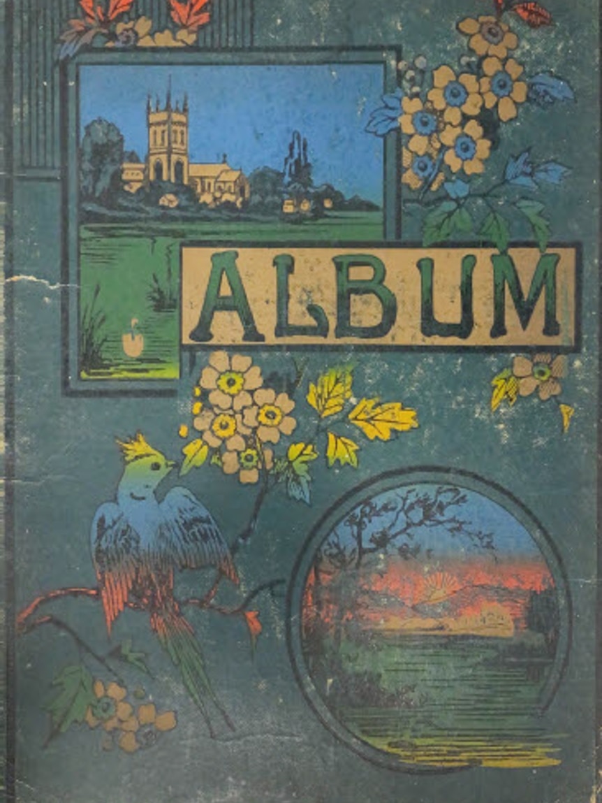 A colourful cover of an old photo album.