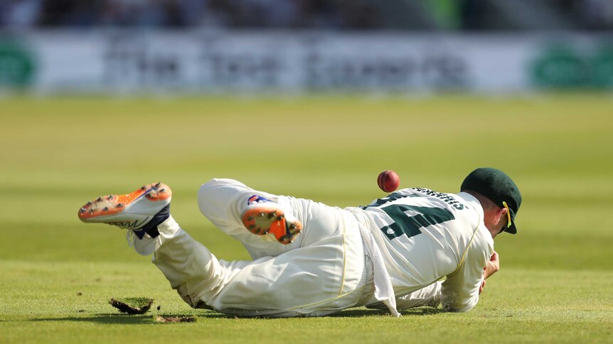 Australia fielder Marcus Harris is in a heap on the floor missing a catch in the deep during the third Ashes Test at Headingley.