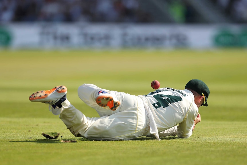 Australia fielder Marcus Harris is in a heap on the floor missing a catch in the deep during the third Ashes Test at Headingley.