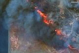 Aerial shot of the fire shows flames and smoke blanketed the island